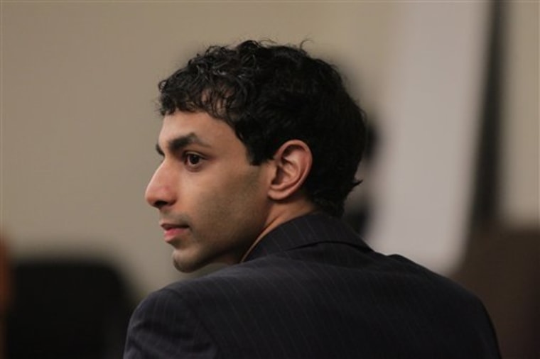 Dharun Ravi listens to testimony during Ravi's trial at the Middlesex County Courthouse in New Brunswick, Monday, March 12, 2012. Ravi, 20, is accused of using a webcam for the central crime, then using Twitter, instant messages and texts to tell friends about it. He's charged with 15 criminal counts, including bias intimidation and invasion of privacy. His roommate, Tyler Clementi, committed suicide in September 2010, just days after the alleged spying. (AP Photo/The Star-Ledger, John O'Boyle, Pool)